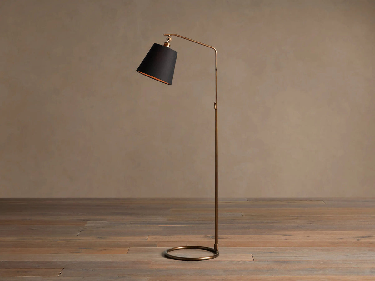 Brass Floor Lamp with Antiqued Finish and Black Shade